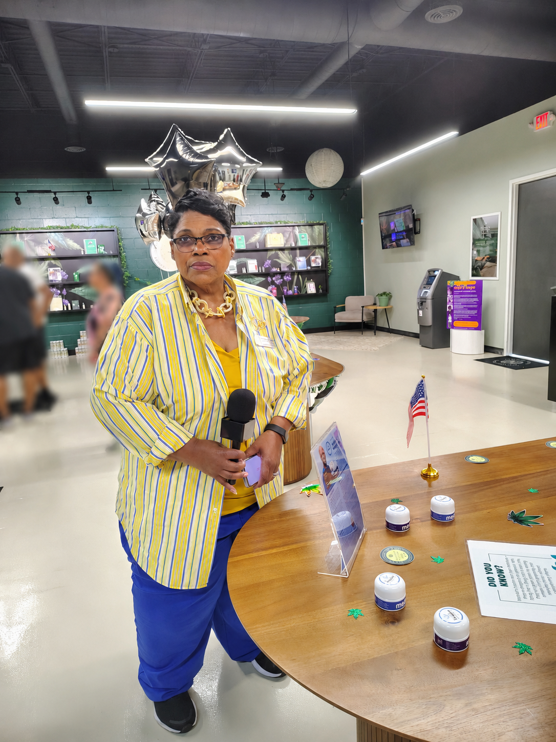 Woman speaking at community event table